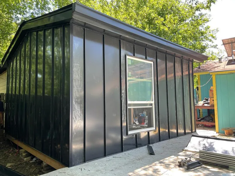 Black standing seam metal wall panels for Roof Inspection in Gretna